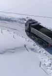 Truck on a snow-covered road, picture from episode 1 of the webseries "Drivers are Heroes"
