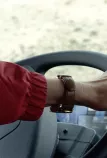 Driving, close-up on her left hand, picture from episode 2 of the webseries "Drivers are Heroes"