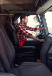 Driver at the wheel of his Renault Truck T High