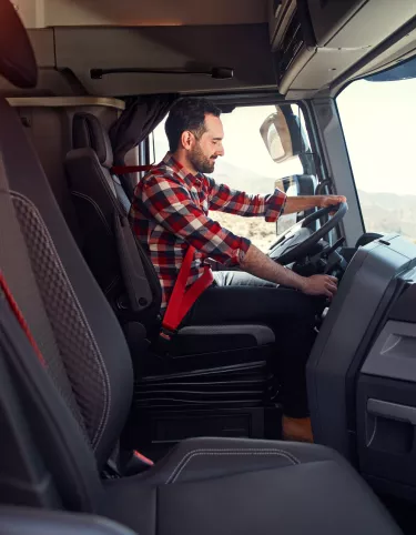 Driver at the wheel of his Renault Truck T High